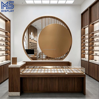 Meubles de présentation pour magasin d'optique sur mesure, étagère murale moderne à LED pour lunettes, table îlot pour lunettes de vue et de soleil, boutique de vente au détail