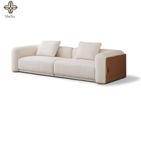 Chinesischer Hersteller: 10-Sitzer Wohnzimmermöbel, Modernes Luxus-Stoffsofa-Set mit geschwungener Form und Metalldekoration
