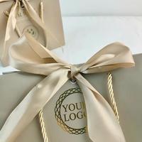 Sac en papier de luxe Youen personnalisé avec logo, couleur or champagne, pour vêtements, avec ruban, idéal pour le commerce de détail