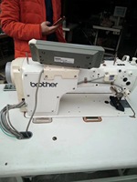Machine à coudre industrielle à point droit à aiguille simple à entraînement direct informatisée Brother S-7200C d'occasion