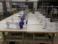 Machine à coudre industrielle à point droit simple aiguille JUKI DDL-7000A-7 d'occasion, ensemble complet