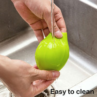 OEM & ODM 8.2*7.5cm Vente en gros Outil d'épluchage de cuisine créatif et utile Éplucheur d'ail en silicone à roulettes