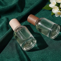 Flacon de parfum élégant de 50ml avec pulvérisateur et bouchon en bambou Récipients de maquillage Flacon de parfum rond en verre