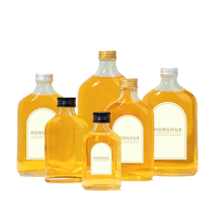 Bouteilles en verre transparentes plates en gros, prêtes à être expédiées, pour l'emballage de vin, de jus, de café et de boissons, avec bouchons