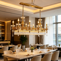 Lustre rectangulaire européen en cristal sculpté doré avec chaîne de bougies suspendues pour l'éclairage des espaces de restauration d'hôtel