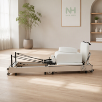 Machine de Pilates pliable en bois massif avec ressorts pour studio de gym et rééducation physique