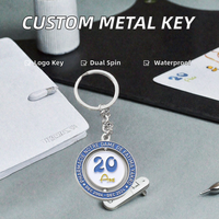Porte-clés promotionnels personnalisés OEM en alliage de zinc, rotatifs double face, avec logo lettre émaillé imprimé UV, pour anniversaire d'entreprise