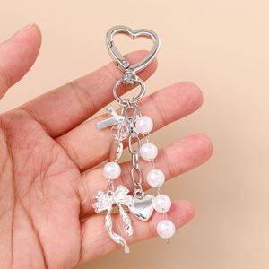 Porte-clés en forme de cœur, porte-clés décoratif pour femme avec nœud en perles et strass, pendentif de sac, cadeau - Product Image 3