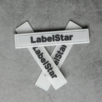 Etiquette en caoutchouc de silicone transparente et souple gaufrée 3D de logo de marque personnalisé pour vêtement