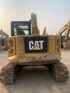 Mini-excavatrice sur chenilles compacte CAT 310 d'occasion pour la construction et l'aménagement paysager - Product Image 1