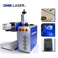 Machine de marquage laser CO2 pulsé de type split DMK 30W-40W, système Galvo refroidi par air avec vitesse élevée de 7000 mm/s pour le codage des matériaux non métalliques
