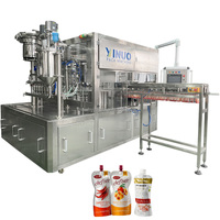Remplissage automatique rotatif scellage liquide Doypack jus lait Sauce eau Machine à emballer bec poche remplissage capsulage Machine