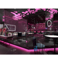 Comptoir de bar rond éclairé par LED de discothèque à motif de fleurs en marbre personnalisé en usine