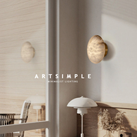 Applique murale artisanale en albâtre en forme de galet |   Applique murale LED minimaliste en laiton pour couloir
