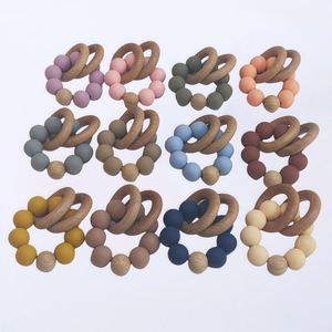 Anneau de dentition circulaire en bois et silicone écologique pour bébé, idéal pour les fêtes et les cadeaux. - Product Image 1
