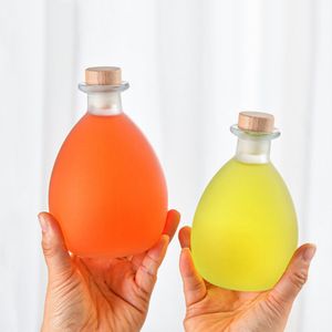 Botella de vidrio transparente y esmerilada al por mayor, vacía, de 100ml, 250ml, 380ml, 500ml, 750ml, con forma de gota de agua, redonda, para vino de frutas y bebidas, con corcho. - Product Image 1