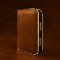 Étui de luxe en cuir véritable pour iPhone Duo, avec rabat magnétique et fentes pour cartes, finition huilée