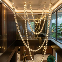 Lustre moderne de luxe en laiton cascade, suspension en forme de U, éclairage à économie d'énergie 2700K blanc chaud doux pour salon