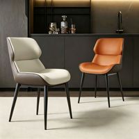 Ensemble de chaises de salle à manger en métal au design simple et luxueux contemporain et table de salle à manger avec revêtement en cuir pour la vente en gros de meubles de maison