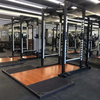 Equipo de gimnasio Power Racks Levantamiento de pesas Entrenamiento de fuerza Jaula comercial para el hogar Estante de sentadillas con plataforma