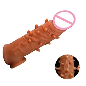 Hot Selling Lange Dikke Slijtage Siliconen Mouw Delay Condoom Prikkels Volwassen Producten Dildo Heren Vloeibare Deeltje