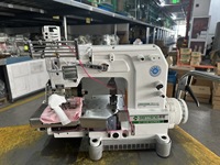 Machine à coudre ST 008-12064P/VPL à 12 aiguilles pour l'application de rubans sur les vêtements de sport