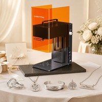 Vente en gros Machine de gravure laser double source pour bijoux métalliques, gobelets isothermes, bagues, bracelets, trophées