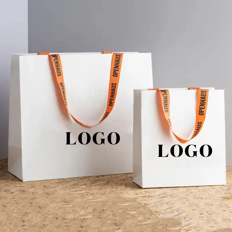 Wholesale luxury matte paper bags customizable design with logo and ribbon handle recycled materials shopping paper bags