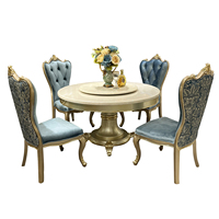 Ensemble de table à manger ronde en marbre de style français luxueux. Bois massif sculpté à la main. Convient aux salles à manger des maisons de luxe et des villas.