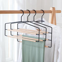 Cintre à pantalons multi-niveaux en métal et fer avec barres rondes en bois pour armoire et séchage du linge