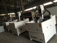 Machine de gravure sur pierre 4 axes JK-6060, modèle populaire, moteur efficace pour artisanat, moteur PLC, moule métallique, structure fermée, haute performance
