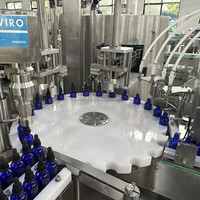 Machine automatique de remplissage et de capsulage antigoutte pour remplisseur de compte-gouttes d'huile essentielle liquide de bouteille de goutte en verre
