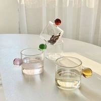 Groothandelsproducten 4oz glaswerk milieuvriendelijk herbruikbaar klein hoog borosilicaat glazen thee-koffiekopje met gekleurde bolvormige handgreep