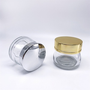 ขวดแก้วใสขนาด 50 กรัม 100 กรัม สำหรับครีมทาตัว/ใบหน้า/รอบดวงตา ปากกว้าง ทรงกลม พร้อมฝาโลหะสีเงิน/สีทอง - Product Image 1