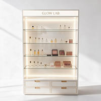 Vitrine à parfums en verre chêne clair avec cadre en métal noir, certifiée CE ETL, directement de l'usine, avec éclairage LED et boîte lumineuse pour présentation de cosmétiques