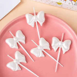 Produsen lilin grosir indah putih kupu-kupu busur lilin kue ulang tahun untuk perayaan dan dekorasi