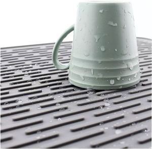 Alfombrilla de silicona plegable de grado alimenticio para aislamiento térmico, protector de ollas, escurridor de platos y tazas, y mantel individual. - Product Image 3