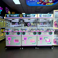 Nouvelle machine à grue métallique pour deux joueurs, une sensation en ligne très prisée, idéale pour les salles d'arcade, centres commerciaux, supermarchés, pour attraper les peluches.