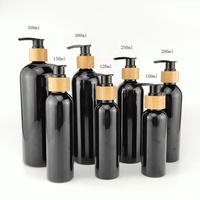 Bouteille de lotion 100ml 120ml 150 ml 200ml 250ml 300ml 500ml bouteilles en plastique noir vide bouteille de pompe en bois de bambou pour shampooing