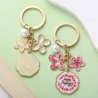 Großhandel Bunter Emaille-Schmetterling Blumen-Schlüsselanhänger Zinklegierung Perlen-Taschenanhänger Schlüsselring Muttertagsgeschenk Damen Handtasche