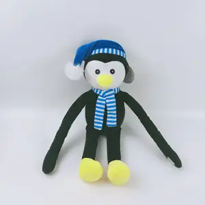 Jouet de Noël en peluche pingouin doux et mignon pingouin avec chapeau bleu pingouin noir en peluche avec écharpe à rayures bleues