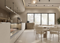 Aménagement intérieur moderne de boulangerie, comptoir bar incurvé, présentoir à pâtisseries, mobilier sur mesure pour toute la boutique, rénovation de boulangerie.