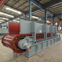 Plaque d'alimentation pour machines de manutention de matériaux en vrac