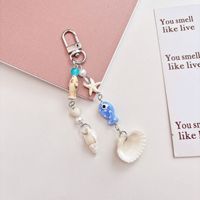 Colgante de concha de cerámica con forma de pez, cadena para teléfono móvil, llavero, estilo Ins, colgante para bolso con concha marina y estrella de mar, colgante para bolso hecho a mano con temática oceánica y cuentas