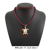 Collier ethnique tressé à la main pour femmes Ocean Wind, perles en forme de boule dorée et perles animales en alliage, idéal pour les cadeaux d'été