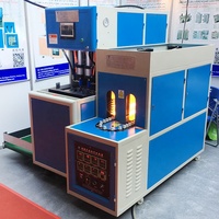 Machine de soufflage PET semi-automatique à 2 cavités avec pompe FESTO et moteur Mitsubishi pour des bouteilles de boisson en plastique à haute productivité