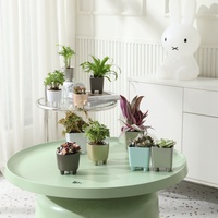 Pots de plantes circulaires en plastique avec pieds, moulage direct, processus de peinture par pulvérisation, design minimaliste moderne pour la maison et le bureau
