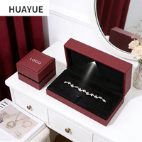 Boîte à bijoux Huayue avec logo personnalisé en couleur, éclairage LED, pour pendentif, bracelet, bijoux, avec lumière