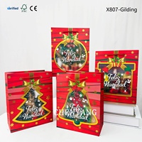 Sac en papier noir de Noël avec logo pour usine de vêtements, fête, shopping, petites bougies, jouets faits main, impression sur carton bleu, noir