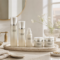 Bouteilles et pots cosmétiques cylindriques haut de gamme en verre à bouchon conique évasé pour ensemble de soins de la peau premium 30g 50g 40ml 100ml 120ml